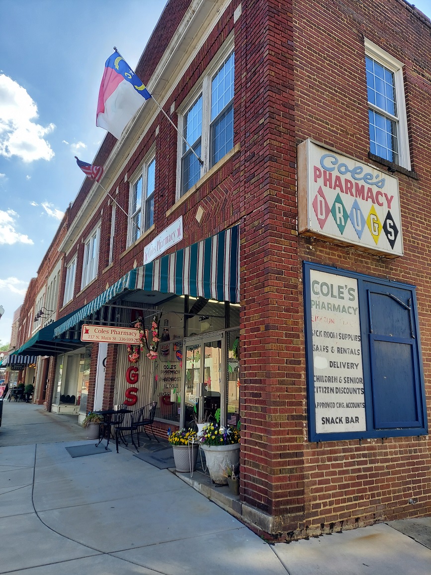 how to write a short story about a pharmacy on Main Street in a small town